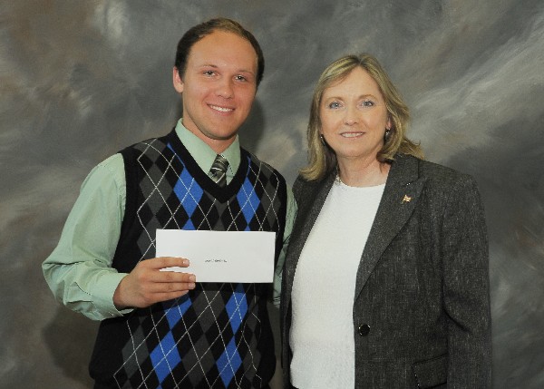 Mission Hills High School Student David Taylor III receives a Senior Scholarship from Chapter Vice-President for Programs Debie Burford in May.